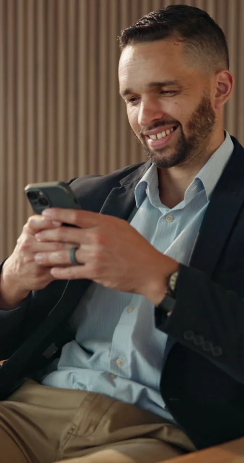 Phone, smile and text message with business man in office for break Stock Footage 334436191