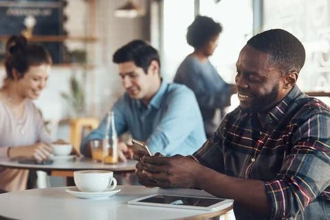 Phone, smile and text message with man in coffee shop for communication or .. Stock Photos
