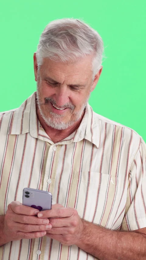 Phone, smile and typing with man on green background for communication, feedback Stock Footage 340805671