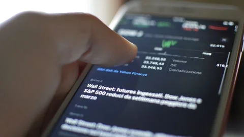 Phone trading chart analysis. broker analyzing trading chart on iphone screen. Stock-Footage 240696689