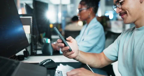 Phone, typing and programmer with person in office for ui developer, code update Stock Footage 309037974