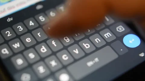 Phone typing sms on digital phone keyboard. iphone communication. Stock Footage 297844423