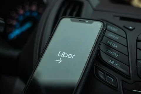 A phone with Uber Driver App running with a start page on screen Stock Photos