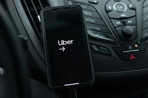 A phone with Uber Driver App running with a start page on screen Stock Photos