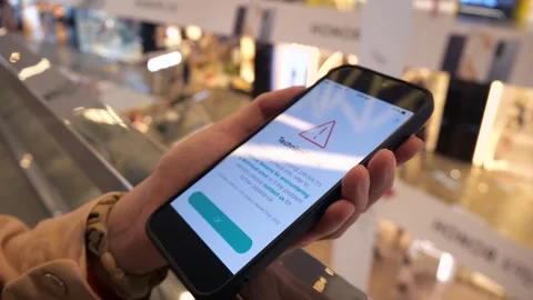 A phone in the user's hands with a notification on the screen Stock Footage 285653819