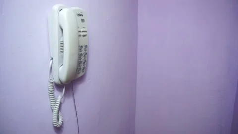 Phone on the wall in the corner rinning Stock Footage 139527548