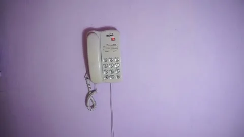 A phone on the wall rinning Stock Footage