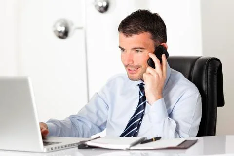 On the phone at work Stock Photos