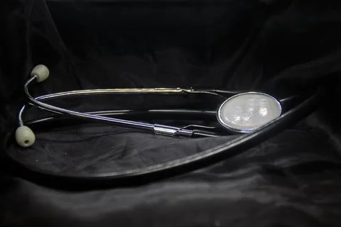 Phonendoscope on a dark background Photos