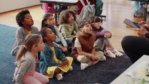 Phonetics lesson in a first grade class: Elementary school children participatin Stock Footage 239864038