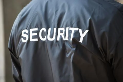 Photo Of Back Of Security Guard Jacket Stock Photos