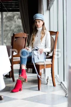 Photo of a beautiful girl in the interior of the restaurant Stock Photos