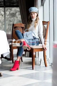 Photo of a beautiful girl in the interior of the restaurant Stock Photos