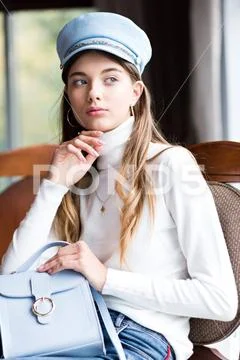 Photo of a beautiful girl in the interior of the restaurant Stock Photos