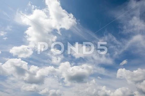 Photo of bright blue sky with white clouds Stock Photos