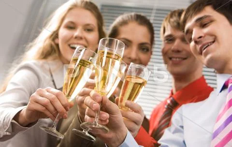 Photo of businesspeople cheering up their flutes filled with sparkling champagne Stock Photos