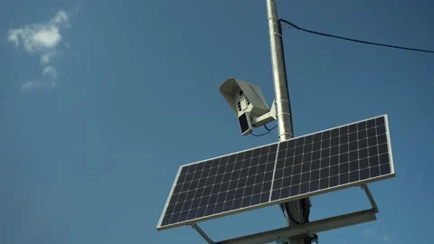 Photo camera monitors the rules of the road. Camera on a pole with a solar panel Stock Footage 209351328