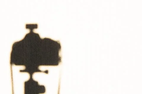 Photo camera shadow on the wall with copy space for text. Video camera Stock Photos