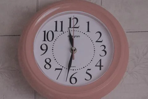 A photo of a clock on the wall Stock Photos