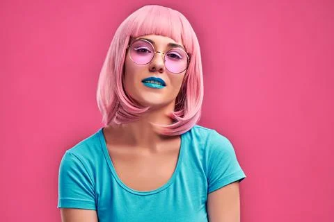 Photo close up view of sexual charming woman with pink hair wearing trendy su Stock Photos