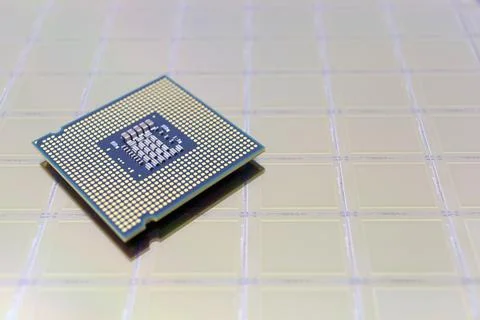 Photo of a Computer Chip CPU put on silicon wafer with microchip Stock Photos