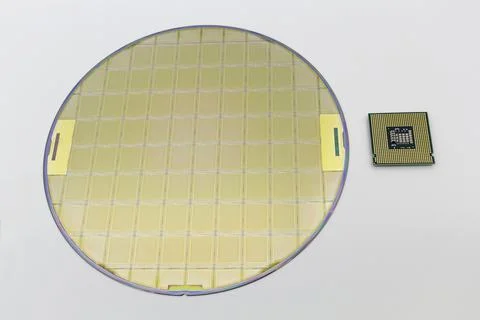 Photo of a Computer Chip CPU put near silicon wafer with microchip Stock Photos