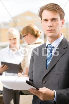 Photo of confident man looking at camera in working environment Stock Photos