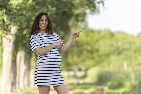 Photo with copy space to insert something with a pregnant woman pointing Stock Photos
