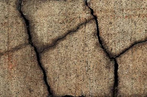Photo of a cracked stone surface Stock Photos