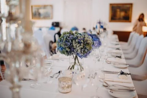 Photo of dinner table with empty plates on Stock Photos