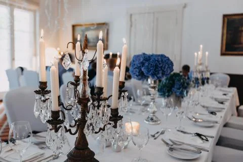 Photo of dinner table with empty plates on Stock Photos