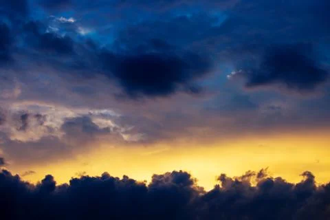 Photo of dramatic sunset with dark clouds Stock Photos