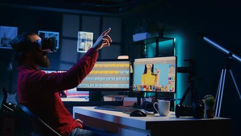 Photo editor using virtual reality technology to browse through photoshoot Stock Photos