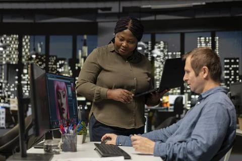 Photo editors using AI tools and program for retouching and generating content Stock Photos