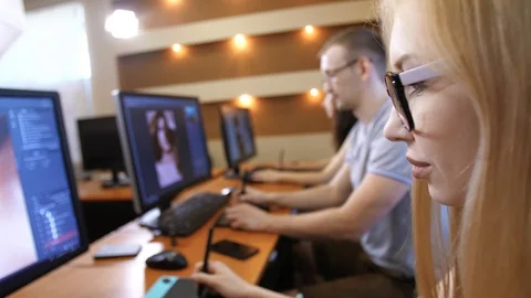 Photo editors working on PC Stock Footage 99273070