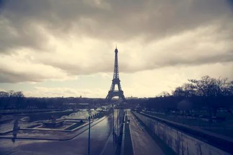 Photo of Eiffel Tower with dramatic sky, Paris, France Stock Photos