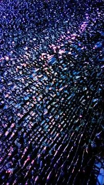 The photo features a stunning array of shattered glass pieces scattered across a Stock Photos