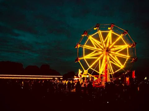 Photo of a ferris wheel, illuminated at dusk- modified Stock Photos