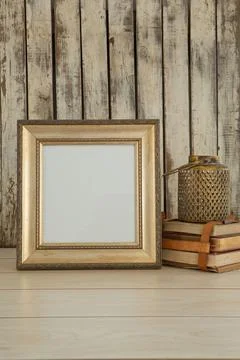 Photo frame and book stack on table Stock Photos