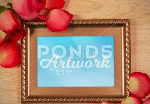 Photo frame template on wooden table PSD Template