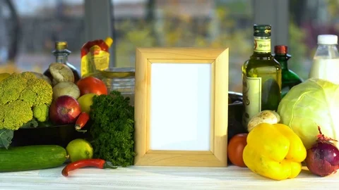 Photo frame on the vegetable background Stock Footage 85175047