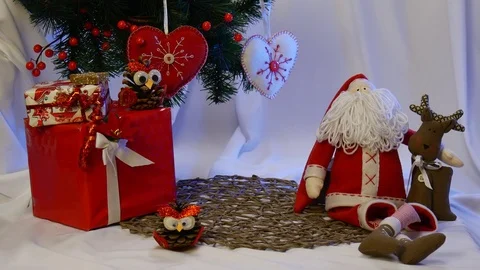 Photo Frames Are Placed Near an Impressive Santa Claus and His Friend Brown Stock Footage 72548974