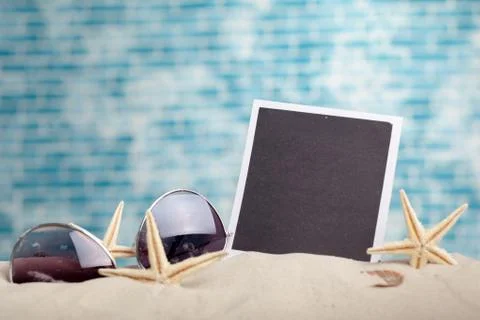 Photo frames on the beach with seashells around Stock Photos