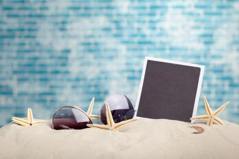Photo frames on the beach with seashells around Stock Photos