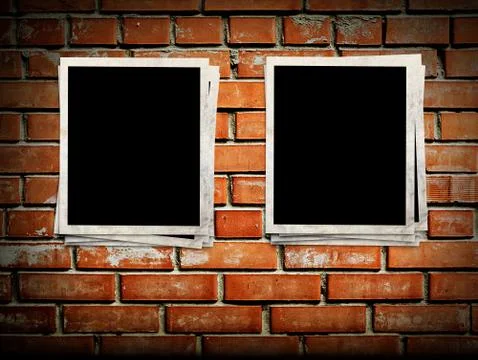 Photo frames on the brick wall Illustrazione stock