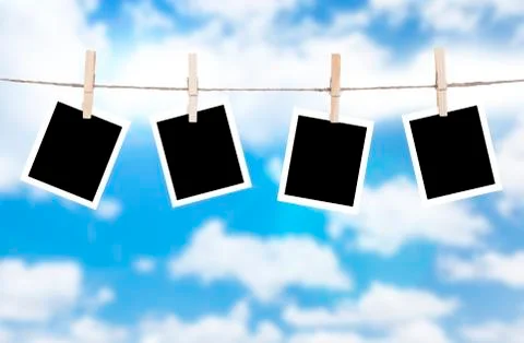 Photo frames hanging on a rope Stockillustratie