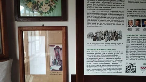 Photo frames with pictures and documents in a museum in Pozuzo, Peru Stock Footage 283305295