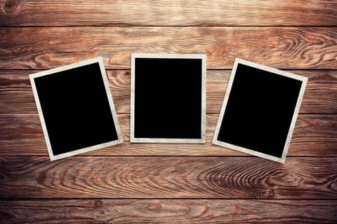 Photo frames on wooden background Stockillustratie