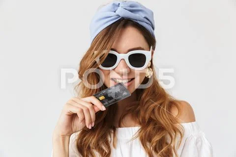 Photo of gorgeous caucasian woman 20s wearing sunglasses looking aside and bi Stock Photos