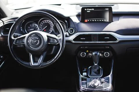 Photo of the interior of the car. Steering wheel, dashboard. Stock Photos
